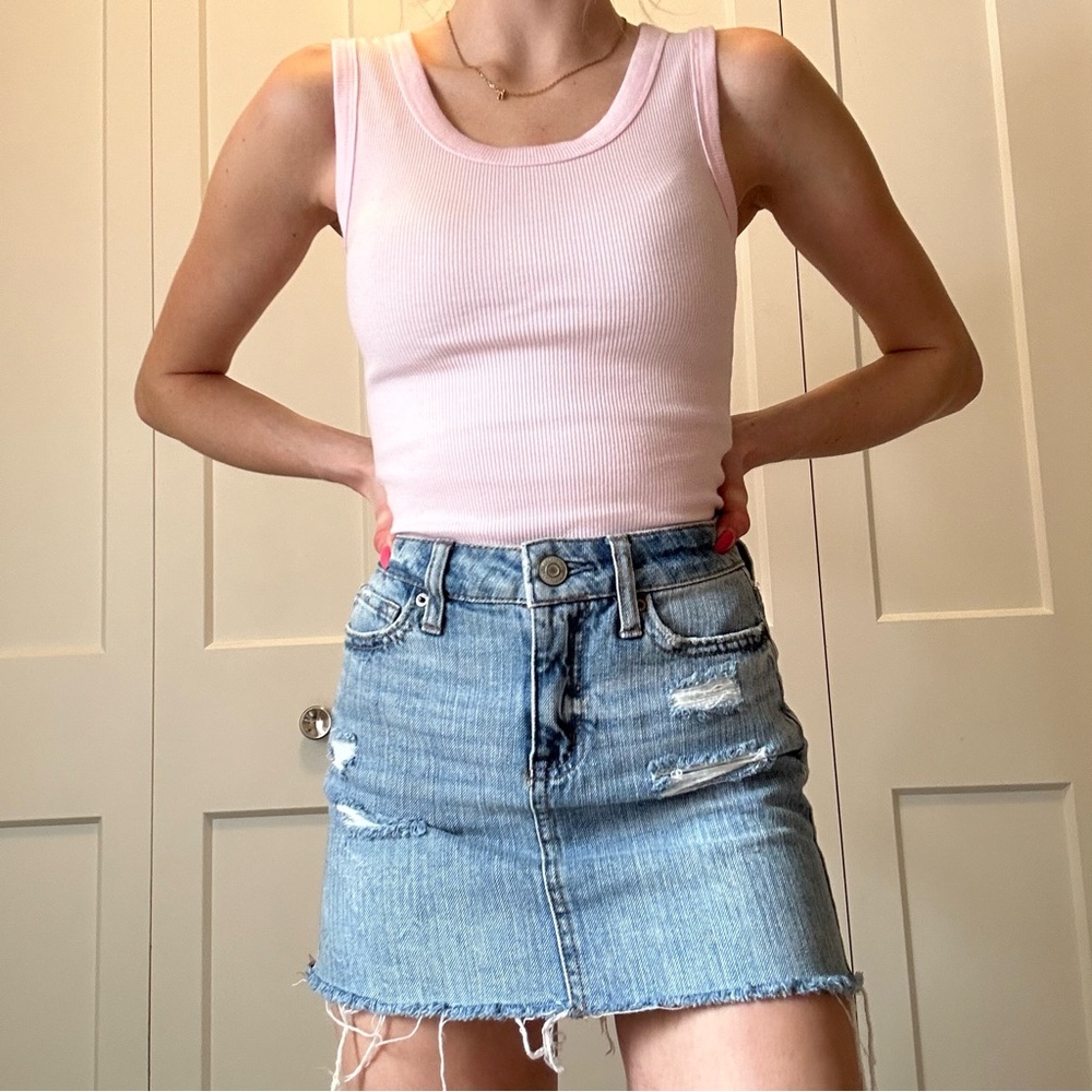 Mini, distressed, blue denim skirt, high waisted. Size 000